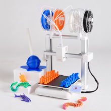 Cargar imagen en el visor de la galería, Toybox Luna Deluxe 3D Printer Bundle: Luna 3D printer loaded with four Printer Food rolls, with a multicolor chess set and toys
