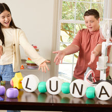 Cargar imagen en el visor de la galería, Kids showing off LUNA letters printed on Toybox Luna